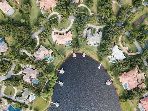 aerial view aerial photography of body of water surrounded with buildings landscape
